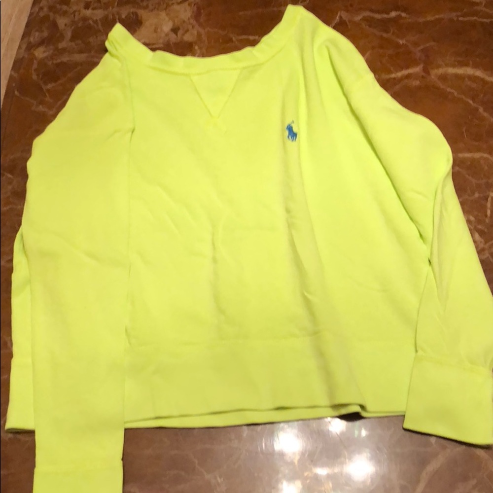 A yellowish greenish sweater